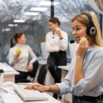 woman-working-call-center-talking-with-clients-using-headphones-microphone_23-2149256145.jpg