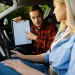 woman-and-man-with-checklist-driving-school.webp