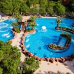 aerial-view-aqua-park-with-large-pools-slides-luxurious-beach-resort-hotel-perfect-fun-relaxing-vacation_664057-246.jpg