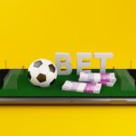 freepicdownloader.com-3d-illustration-smartphone-with-football-field-yellow-background-normal.jpg