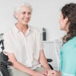 nurse-looking-female-senior-patient-wheel-chair_23-2147861530.jpg