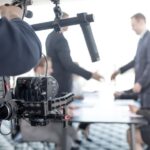 videographer-using-steadycam-making-video-business-people-shaking-hands_394555-538.jpg