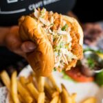 The-CRISPY-CHICKEN-sandwich-is-packed-with-buttermilk-coleslaw-cilantro-fresh-lime-spicy-mayo-and-a-drizzle-of-Korean-BBQ-CrispyChicken-ComfortFood-BlackTapThat-2.jpg