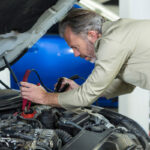 mechanic-attaching-jumper-cables-car-battery-1.jpg