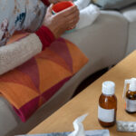 closeup_holding_mug_next_to_cold_medicine_1214954795.jpg