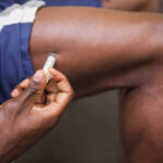 muscular-man-injecting-steroids.jpg