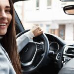 elegant-woman-driver-looking-backseat-smiling-happy-1-1-1.jpg