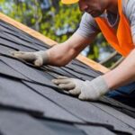ai-generated-construction-worker-hands-working-on-roof-tiles-installation-closeup-generative-ai-photo.jpeg