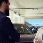 informed-salesperson-answering-questions-car-dealership.jpg