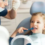 Canva-Doctordentistteachingachildtobrushteeth.webp