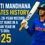 Smriti-Mandhana-celebrates-historic-record-in-2025-breaking-a-28-year-old-milestone-for-most-runs-in-Womens-ODI-cricket-—-Indian-cricketer-in-blue-jersey-holding-bat-with-determination.png