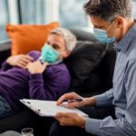 male-psychiatrist-going-through-data-his-patient-while-having-appointment-coronavirus-pandemic2.jpg