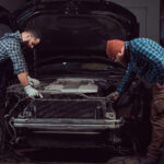 service-station-two-bearded-brutal-mechanics-repairing-car-garage.jpg