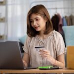 young-asian-woman-using-credit-card-shopping-website-by-laptop-computer-online-shopping-ecommerce-concept.jpg